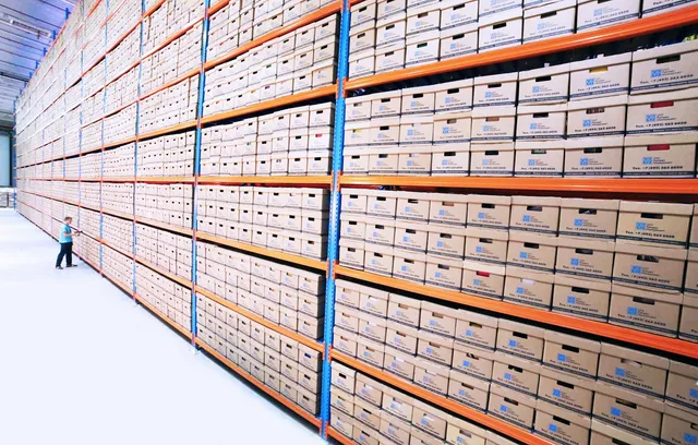Shelves of archived health and safety documentation files