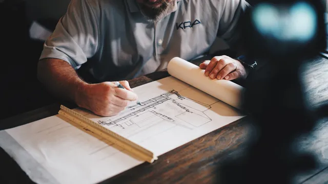 Engineer reviewing plans during an incident investigation